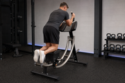 Ab Coaster CS3000 Commercial Ab Machine being used with controlled bottom-up abdominal exercise form