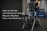 Life Fitness Arc Trainer with a user demonstrating proper lower-body form