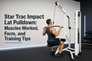Star Trac Impact Lat Pulldown being used with proper upright form and controlled movement